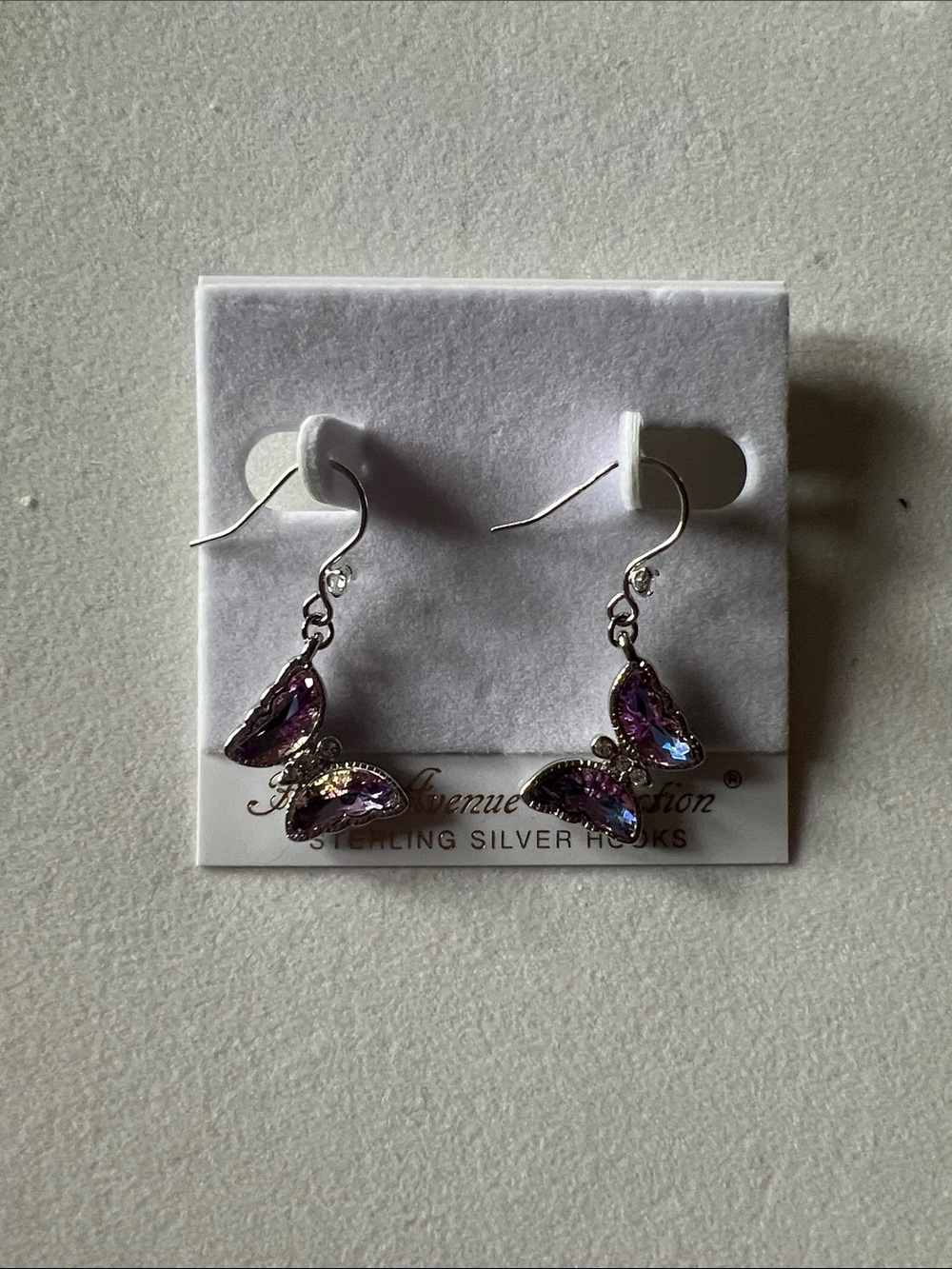 Silver Butterfly Drop Earrings with Purple Crystals
